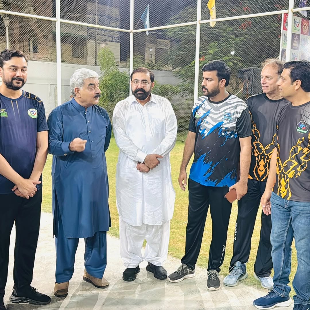 Cricket teams lined up before a match at the club ground