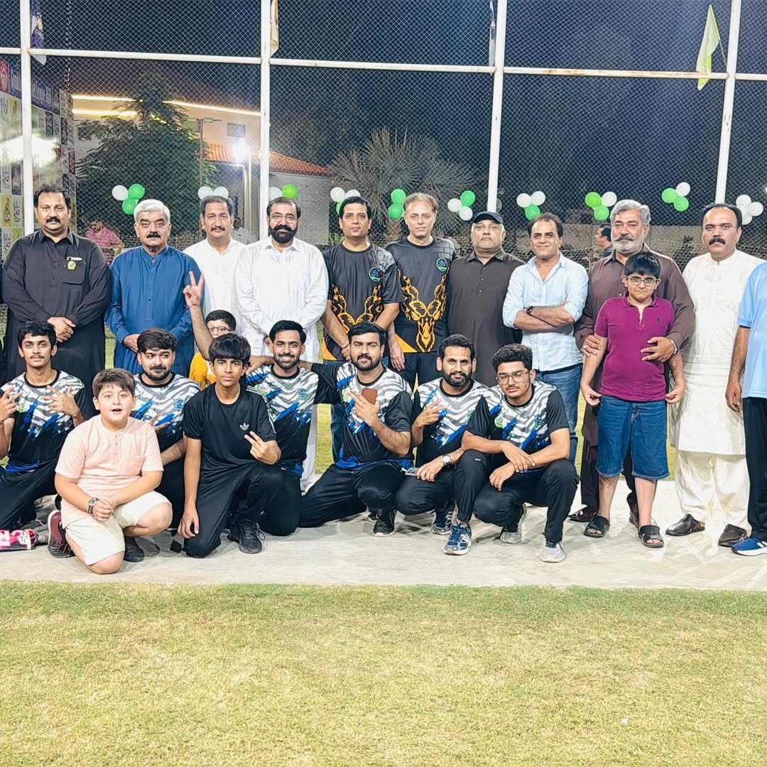 Cricket league match under floodlights at the club ground